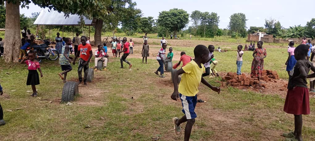 Children playing in a grassy open space